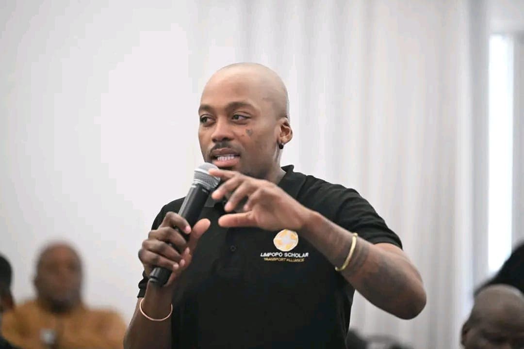 LSTA public relations officer Mr Thapedi Kgole speaking into a microphone at a public inquiry